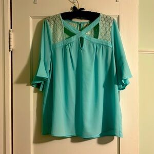 Sheer top with lace detailing on top and back